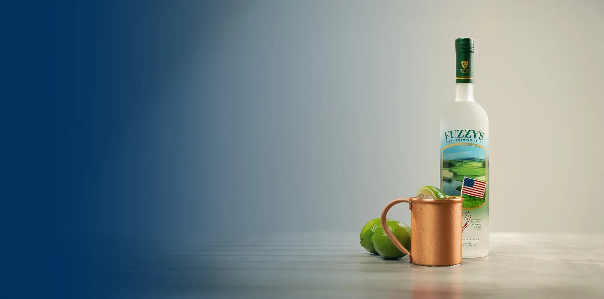 Fuzzy's Vodka bottle with a copper cup with American Stallion cocktail