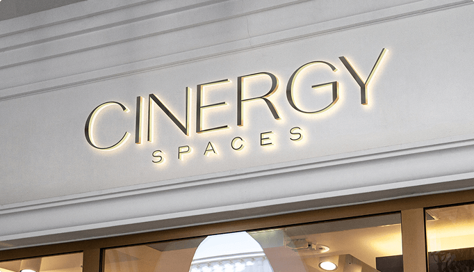 Mockup of an illuminated storefront sign reading ‘Cinergy Spaces