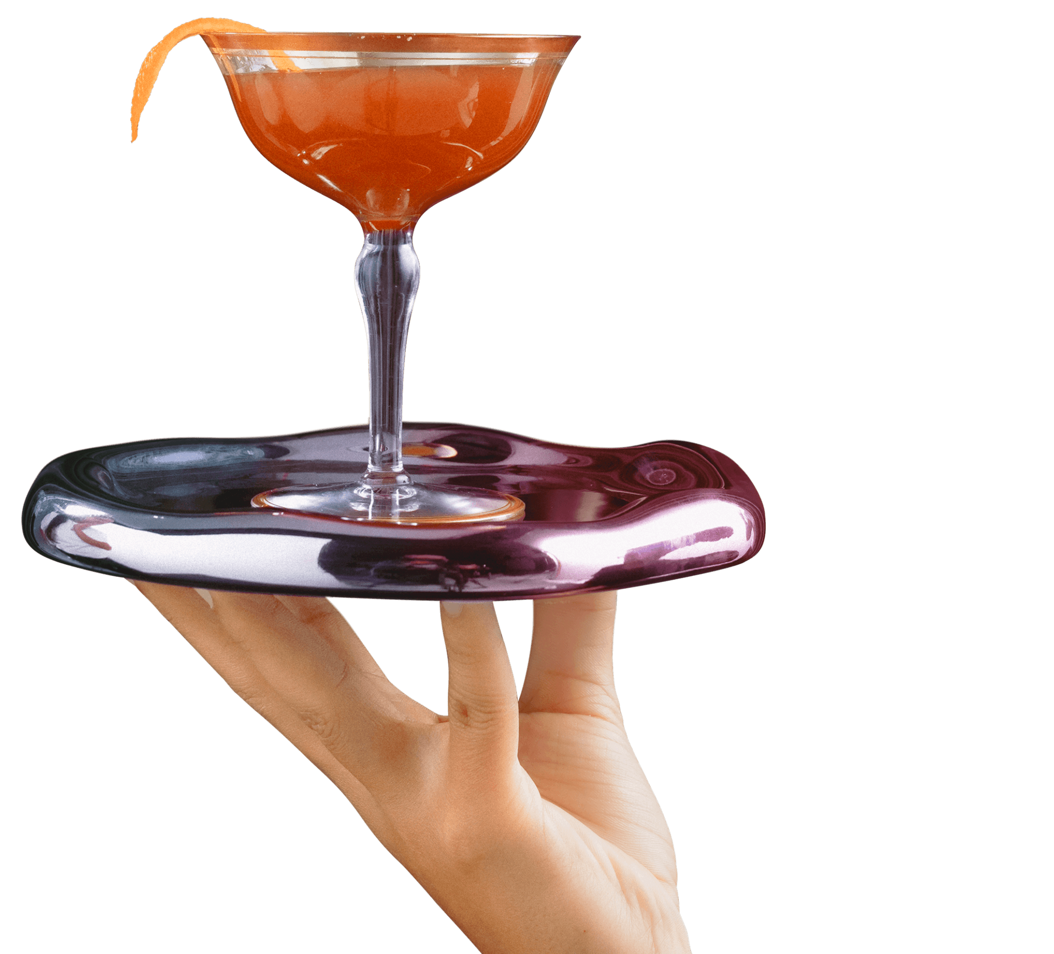 Hand holding a metallic, fluid-shaped tray with a coupe glass of Munyon's Paw-Paw orange cocktail garnished with a citrus twist